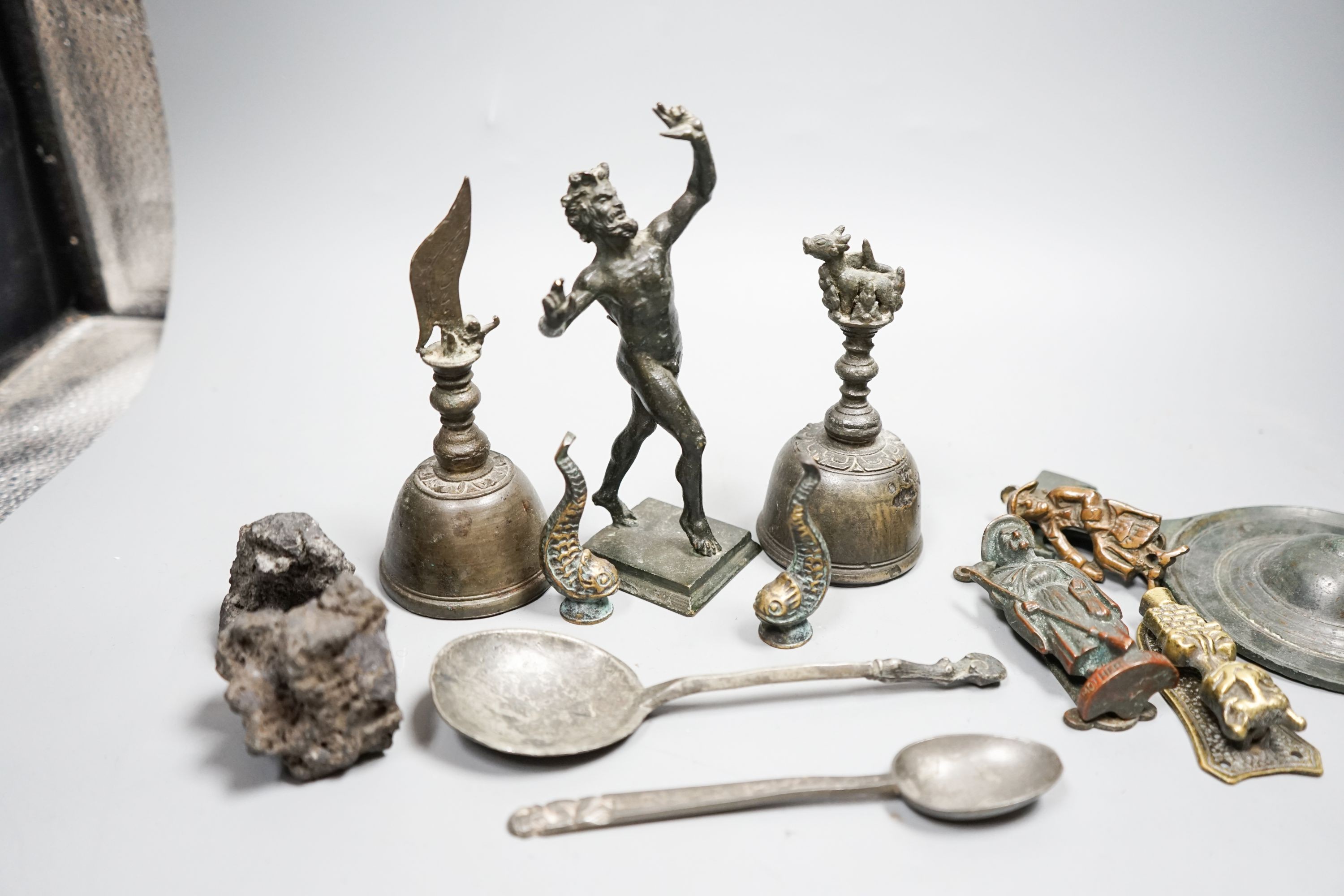 A small quantity of decorative metalware, including two bronze table bells, a bronze faun, 17cm, pewter spoons, etc.